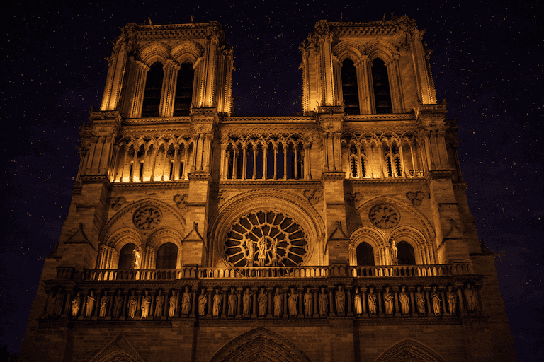 Notre-Dame Cathedral under starry night sky